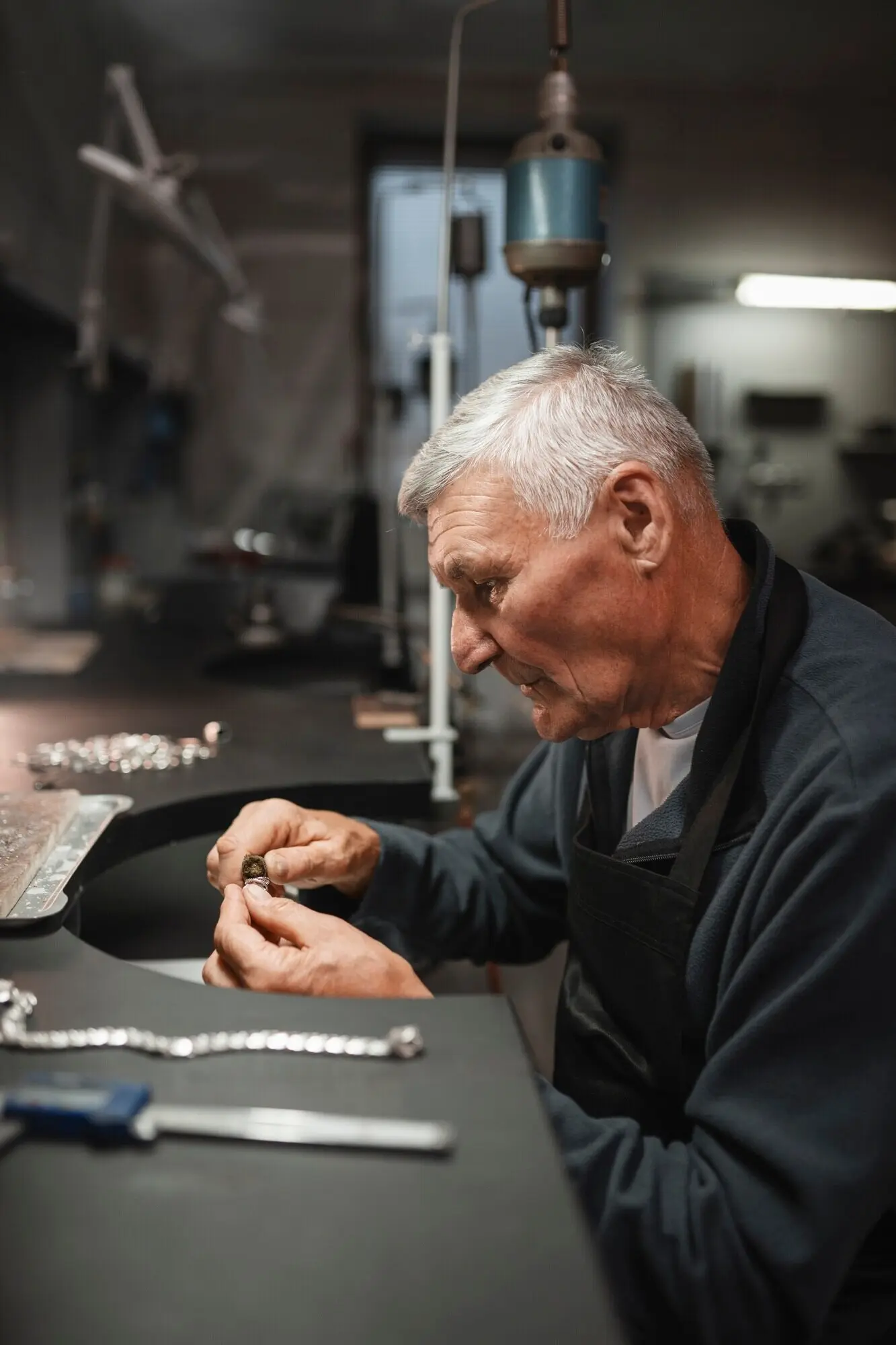 A male jeweler at work in the shop