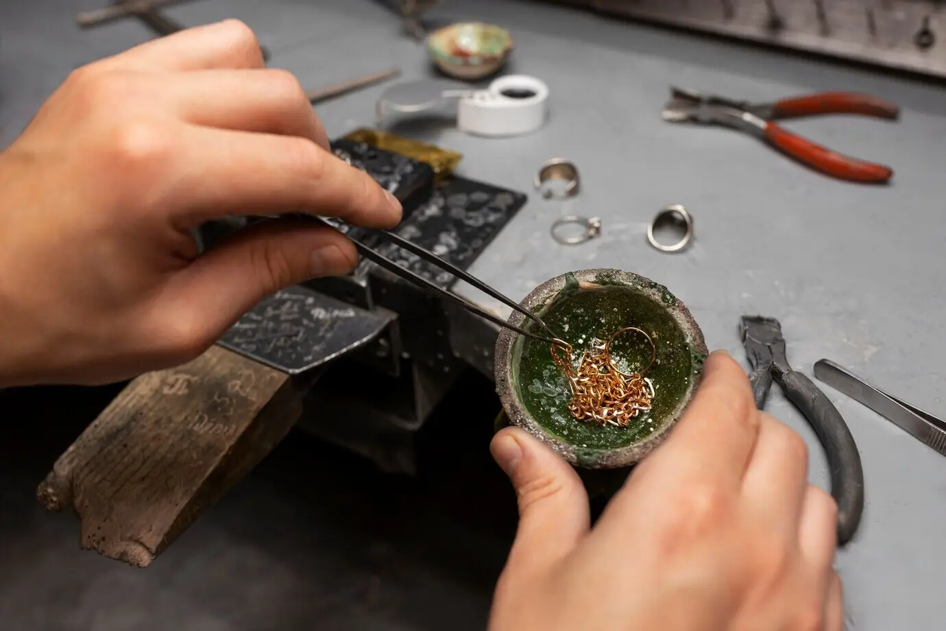 The hands of a jeweler making jewellery