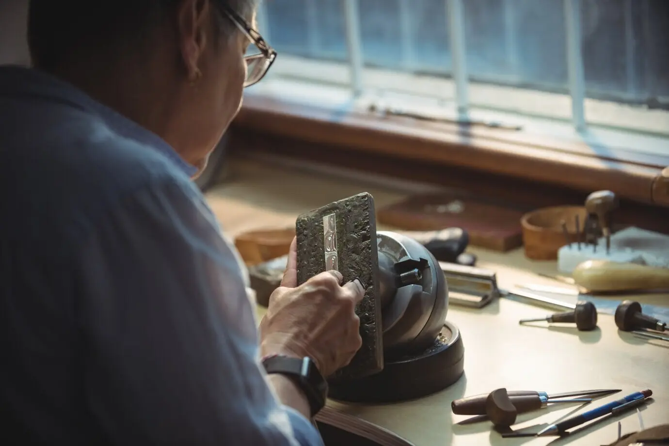 A craftswoman working in a workshop.